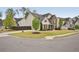 Traditional home featuring manicured lawn and landscaping plus a modern color palette of neutral beige and brown brick at 2100 Baywood Sw Blvd, Austell, GA 30106