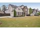 Charming two-story home features a well-maintained lawn, landscaping and a two-car garage at 2100 Baywood Sw Blvd, Austell, GA 30106