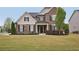 Beautiful two-story home with brick and siding, manicured lawn, and tasteful landscaping at 2100 Baywood Sw Blvd, Austell, GA 30106