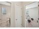 Hallway featuring doorways to a half bath and exercise room at 2100 Baywood Sw Blvd, Austell, GA 30106