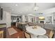 Open concept kitchen and living area with stainless appliances, island, and fireplace at 2100 Baywood Sw Blvd, Austell, GA 30106