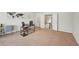 Open office space with neutral paint, carpet, and a view of the hallway and staircase at 2100 Baywood Sw Blvd, Austell, GA 30106