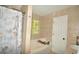 Ceramic tiled full bathroom featuring a shower, tub, white door, and decorative shower curtain at 2176 Cold Springs Cir, Lithonia, GA 30058