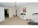 A bedroom with neutral colored walls, a treadmill, art on the wall, and a closet in view at 2176 Cold Springs Cir, Lithonia, GA 30058