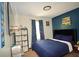 Comfortable bedroom with modern decor, a plush bed, and ample storage space at 2176 Cold Springs Cir, Lithonia, GA 30058