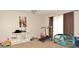 The bedroom features a treadmill, play area, art on the wall, and curtains on the window at 2176 Cold Springs Cir, Lithonia, GA 30058