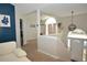 Welcoming entryway showcasing stylish light fixtures, neutral colors, and staircase at 2176 Cold Springs Cir, Lithonia, GA 30058