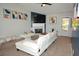 Inviting living room with a cozy fireplace, a stylish couch, and modern decor at 2176 Cold Springs Cir, Lithonia, GA 30058