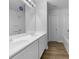Clean bathroom with double sink vanity, a full mirror and a bathtub with shower at 325 Freeman Cir, Villa Rica, GA 30180