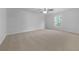 Spacious bedroom featuring neutral carpeting, a ceiling fan, and natural light from window at 325 Freeman Cir, Villa Rica, GA 30180