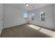 Bright bedroom with new carpet, fresh paint, and three windows offering plenty of natural light at 325 Freeman Cir, Villa Rica, GA 30180