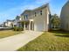 Charming two-story home with a front porch, driveway, and attached garage at 325 Freeman Cir, Villa Rica, GA 30180