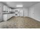 Clean white kitchen with modern appliances, ample cabinet space, and durable vinyl flooring at 325 Freeman Cir, Villa Rica, GA 30180