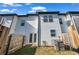 Fenced backyard featuring a small lawn and patio, ideal for relaxing and enjoying the outdoors at 4142 Spring Valley Cir # 65, Tucker, GA 30084