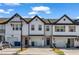Charming townhome with white siding, black trim, and a one-car garage, creating an inviting curb appeal at 4142 Spring Valley Cir # 65, Tucker, GA 30084