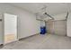 Spacious garage with concrete floor, garage door, and side door leading into the home at 4142 Spring Valley Cir # 65, Tucker, GA 30084