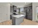 Well-equipped kitchen with stainless steel appliances, grey cabinets, and a center island with white countertop at 4142 Spring Valley Cir # 65, Tucker, GA 30084