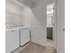 Functional laundry room with modern washer and dryer; bathroom doorway visible at 4142 Spring Valley Cir # 65, Tucker, GA 30084