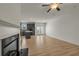 Open floor plan with wood-look floors, an eat-in kitchen with stainless appliances, and fireplace at 4142 Spring Valley Cir # 65, Tucker, GA 30084