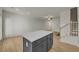 Modern living space with wood-look floors, an eat-in kitchen, and staircase access at 4142 Spring Valley Cir # 65, Tucker, GA 30084