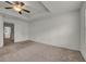 Large carpeted main bedroom with view to the front yard and access to the main bath at 4142 Spring Valley Cir # 65, Tucker, GA 30084