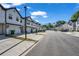 A view of the homes in a community with a well-maintained street and sidewalks at 4142 Spring Valley Cir # 65, Tucker, GA 30084