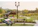 Captured at ground level of the community amphitheater featuring a stage, and terraced lawn seating at 546 Sawnee Village Blvd # D71, Cumming, GA 30040