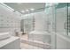 Bright bathroom featuring a soaking tub behind a glass shower enclosure at 120 Ralph Mcgill Ne Blvd # 1304 & 1305, Atlanta, GA 30308