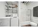 Bathroom laundry room featuring washer, dryer, shower, and tiled floors at 120 Ralph Mcgill Ne Blvd # 1304 & 1305, Atlanta, GA 30308