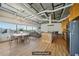 Spacious living and dining area featuring light wood flooring, a dining table, and a comfortable sofa with city views at 120 Ralph Mcgill Ne Blvd # 1304 & 1305, Atlanta, GA 30308