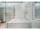Contemporary bathroom featuring a glass-enclosed shower and modern tub at 120 Ralph Mcgill Ne Blvd # 1304 & 1305, Atlanta, GA 30308