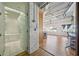 Modern bathroom featuring a glass-enclosed shower, soaking tub, and white tile at 120 Ralph Mcgill Ne Blvd # 1304 & 1305, Atlanta, GA 30308