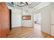 Bedroom featuring wood flooring and large windows with views of the city at 120 Ralph Mcgill Ne Blvd # 1304 & 1305, Atlanta, GA 30308