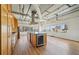 Bright kitchen with wooden cabinets, island, and stainless steel appliances overlooking the city skyline at 120 Ralph Mcgill Ne Blvd # 1304 & 1305, Atlanta, GA 30308