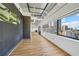 Bright open living room featuring wood floors and a large window with city views at 120 Ralph Mcgill Ne Blvd # 1304 & 1305, Atlanta, GA 30308