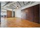 Open living room with exposed ceilings, hardwood floors, and open floor plan at 120 Ralph Mcgill Ne Blvd # 1304 & 1305, Atlanta, GA 30308