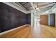 Open living room with exposed ceilings, hardwood floors, and modern aesthetic at 120 Ralph Mcgill Ne Blvd # 1304 & 1305, Atlanta, GA 30308