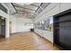 Living room featuring open ceiling, hardwood floors, and beautiful city views at 120 Ralph Mcgill Ne Blvd # 1304 & 1305, Atlanta, GA 30308