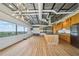 Open living space with stainless steel appliances, an island, and large windows showcasing city views at 120 Ralph Mcgill Ne Blvd # 1304 & 1305, Atlanta, GA 30308