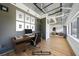 Home office with work desk and chair near a window; modern and efficient space at 120 Ralph Mcgill Ne Blvd # 1304 & 1305, Atlanta, GA 30308