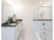 Bright bathroom features dual sinks, luxurious tub, and walk-in shower at 1567 Aiden Way # 34, Conyers, GA 30013