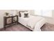 Cozy bedroom with a twin bed, mirrored console table, carpet, and natural light from a window at 1567 Aiden Way # 34, Conyers, GA 30013