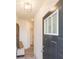 Inviting entryway with a bench seat, decorative mirror, and contemporary lighting fixture to welcome visitors at 1567 Aiden Way # 34, Conyers, GA 30013