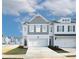 Charming two-story townhome with an attached garage and well-manicured landscaping for a welcoming curb appeal at 1567 Aiden Way # 34, Conyers, GA 30013