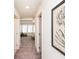 Bright hallway leading into a room with natural light and carpet flooring at 1567 Aiden Way # 34, Conyers, GA 30013