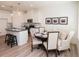 Charming kitchen and dining area with modern appliances, a breakfast bar, and a cozy dining table at 1567 Aiden Way # 34, Conyers, GA 30013