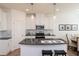 Modern kitchen with sleek countertops, stainless steel appliances, and a stylish backsplash for a sophisticated touch at 1567 Aiden Way # 34, Conyers, GA 30013