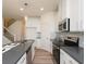 Contemporary kitchen boasting stainless steel appliances, ample counter space, and a convenient breakfast bar at 1567 Aiden Way # 34, Conyers, GA 30013