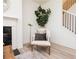 Comfortable living area with a stylish chair, accent lighting, and a view of the staircase and adjacent spaces at 1567 Aiden Way # 34, Conyers, GA 30013