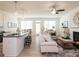 Spacious open floor plan with ample natural light, seamlessly connecting the kitchen, dining, and living areas at 1567 Aiden Way # 34, Conyers, GA 30013